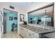 Eat-in kitchen features granite counters, stainless steel appliances, and ample storage at 7405 Bay Island S Dr # 220, South Pasadena, FL 33707