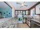 Functional kitchen with granite countertops, white appliances, and ample cabinet space at 7405 Bay Island S Dr # 220, South Pasadena, FL 33707