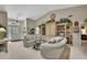 Bright living room showcasing vaulted ceiling, dual sofas, and an elegant entrance at 7435 Woodhollow Rd, Spring Hill, FL 34606