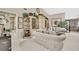 Inviting living room with neutral tones, decorative shelves, and cozy seating at 7435 Woodhollow Rd, Spring Hill, FL 34606