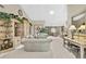 Spacious living room featuring stylish furniture, built-in shelving and ample natural light at 7435 Woodhollow Rd, Spring Hill, FL 34606