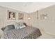 This is the other side of the main bedroom with neutral color and decorative wall art at 7435 Woodhollow Rd, Spring Hill, FL 34606