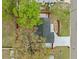 Birds-eye view of a single-story home featuring a new driveway, manicured landscaping, and a dark gray roof at 7480 Hobson Ne St, St Petersburg, FL 33702