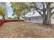 Large backyard with mature trees and privacy fence at 7480 Hobson Ne St, St Petersburg, FL 33702