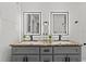 Double vanity with grey cabinets, granite countertop, and black matte faucets at 7480 Hobson Ne St, St Petersburg, FL 33702