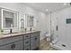 Modern bathroom features double sinks, LED mirrors, and marble tiled shower at 7480 Hobson Ne St, St Petersburg, FL 33702