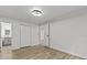 Neutral bedroom with light vinyl flooring, closet, and ensuite bathroom at 7480 Hobson Ne St, St Petersburg, FL 33702
