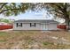 Charming home featuring a well-maintained front yard and a welcoming entrance at 7480 Hobson Ne St, St Petersburg, FL 33702