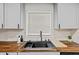 Kitchen sink featuring white cabinets and modern fixtures at 7480 Hobson Ne St, St Petersburg, FL 33702