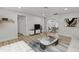 Inviting living room with modern furniture, open to the dining area and featuring stylish decor at 7480 Hobson Ne St, St Petersburg, FL 33702