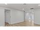 Bright, neutral living room with wood floors and recessed lighting at 7480 Hobson Ne St, St Petersburg, FL 33702