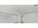 A view of the bright white living room featuring a window and white door at 7480 Hobson Ne St, St Petersburg, FL 33702