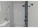 A modern bathroom showing shower featuring decorative tile, and matte black hardware at 7480 Hobson Ne St, St Petersburg, FL 33702