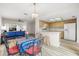 Open-concept dining area, seamlessly connecting the living room and modern kitchen space at 7703 Rockville Ct # 0, New Port Richey, FL 34654
