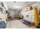 Spacious garage with ample storage space, including shelves and overhead storage at 7703 Rockville Ct # 0, New Port Richey, FL 34654