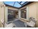 View from patio into kitchen and dining area, providing seamless indoor-outdoor living at 7703 Rockville Ct # 0, New Port Richey, FL 34654