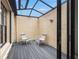 Private, enclosed patio area with chairs and a tranquil outdoor space at 7703 Rockville Ct # 0, New Port Richey, FL 34654