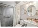 Modern bathroom with a shower, updated fixtures, a sink, and a decorative mirror at 7825 38Th N Ter # 7825, St Petersburg, FL 33709