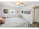 Comfortable bedroom with a ceiling fan, a flat-screen TV, and a doorway at 7825 38Th N Ter # 7825, St Petersburg, FL 33709