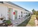 The house exterior offers a well-maintained landscape, a mix of patio areas, and manicured garden beds at 7825 38Th N Ter # 7825, St Petersburg, FL 33709