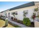 Exterior view of a property with a side yard and patio area at 7825 38Th N Ter # 7825, St Petersburg, FL 33709