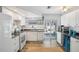 Bright kitchen with white cabinets and countertops and stainless steel appliances for a modern aesthetic at 7825 38Th N Ter # 7825, St Petersburg, FL 33709