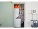 A convenient laundry area features a washer and dryer setup inside with some shelves and storage at 7825 38Th N Ter # 7825, St Petersburg, FL 33709
