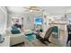 Bright and airy living room with hardwood floors, a comfortable sofa, and easy access to the kitchen at 7825 38Th N Ter # 7825, St Petersburg, FL 33709
