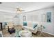 Well-lit living room with a comfortable seating arrangement, perfect for relaxation and social gatherings at 7825 38Th N Ter # 7825, St Petersburg, FL 33709
