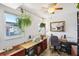 Office with a ceiling fan, a window, an office chair, and plenty of storage space at 7825 38Th N Ter # 7825, St Petersburg, FL 33709