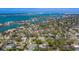 Aerial photograph shows neighborhood homes, and direct access to a waterway at 809 Royal Dr, Largo, FL 33770