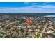 Aerial shot pinpoints single Gathering house nestled in a neighborhood with waterfront access at 809 Royal Dr, Largo, FL 33770