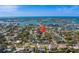 Overhead view focusing on house in a neighborhood near inter coastal waters at 809 Royal Dr, Largo, FL 33770