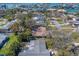 Panoramic aerial shot showcases neighborhood, mature trees, and variety of home styles at 809 Royal Dr, Largo, FL 33770