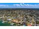 Wide shot displays homes, landscapes, and proximity to a waterfront location with boat docks at 809 Royal Dr, Largo, FL 33770