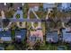Aerial shot of property highlighting lush surroundings in a desirable neighborhood with mature trees at 809 Royal Dr, Largo, FL 33770