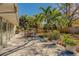 Spacious backyard patio featuring lush landscaping, an outdoor dining area and serene ambiance at 809 Royal Dr, Largo, FL 33770