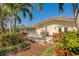 Private backyard featuring lush landscaping, mature trees, and a cozy patio area, creating a tranquil outdoor retreat at 809 Royal Dr, Largo, FL 33770