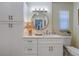 Bathroom featuring single sink with quarts countertops, custom cabinets and a storage cabinet at 809 Royal Dr, Largo, FL 33770
