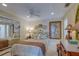 Cozy bedroom with a queen-size bed, mirrored closet, and vintage-style furnishings at 809 Royal Dr, Largo, FL 33770