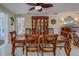 Dining room with wood table set and china cabinet in a neutral color palette at 809 Royal Dr, Largo, FL 33770