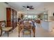 Open dining room with hardwood table, decorative hutch, and lots of natural light at 809 Royal Dr, Largo, FL 33770