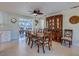 Dining room with neutral colors that features a wooden dining table and display cabinet at 809 Royal Dr, Largo, FL 33770