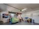 View of the organized garage interior with storage shelves and ample space at 809 Royal Dr, Largo, FL 33770