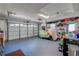 Garage featuring overhead garage doors with storage shelving at 809 Royal Dr, Largo, FL 33770