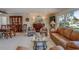 Living room with leather couches and a large bar for entertainment at 809 Royal Dr, Largo, FL 33770