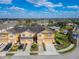 Aerial view of townhomes with attached garages and community amenities at 8842 Turnstone Haven Pl, Tampa, FL 33619