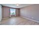 This bedroom has a soft pink wall color, light floors, and a sunny window at 8842 Turnstone Haven Pl, Tampa, FL 33619