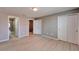 Primary bedroom with modern floors, ensuite bath, and double door closet at 8842 Turnstone Haven Pl, Tampa, FL 33619