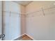 Walk-in closet features white wire shelving for optimal storage and organization at 8842 Turnstone Haven Pl, Tampa, FL 33619